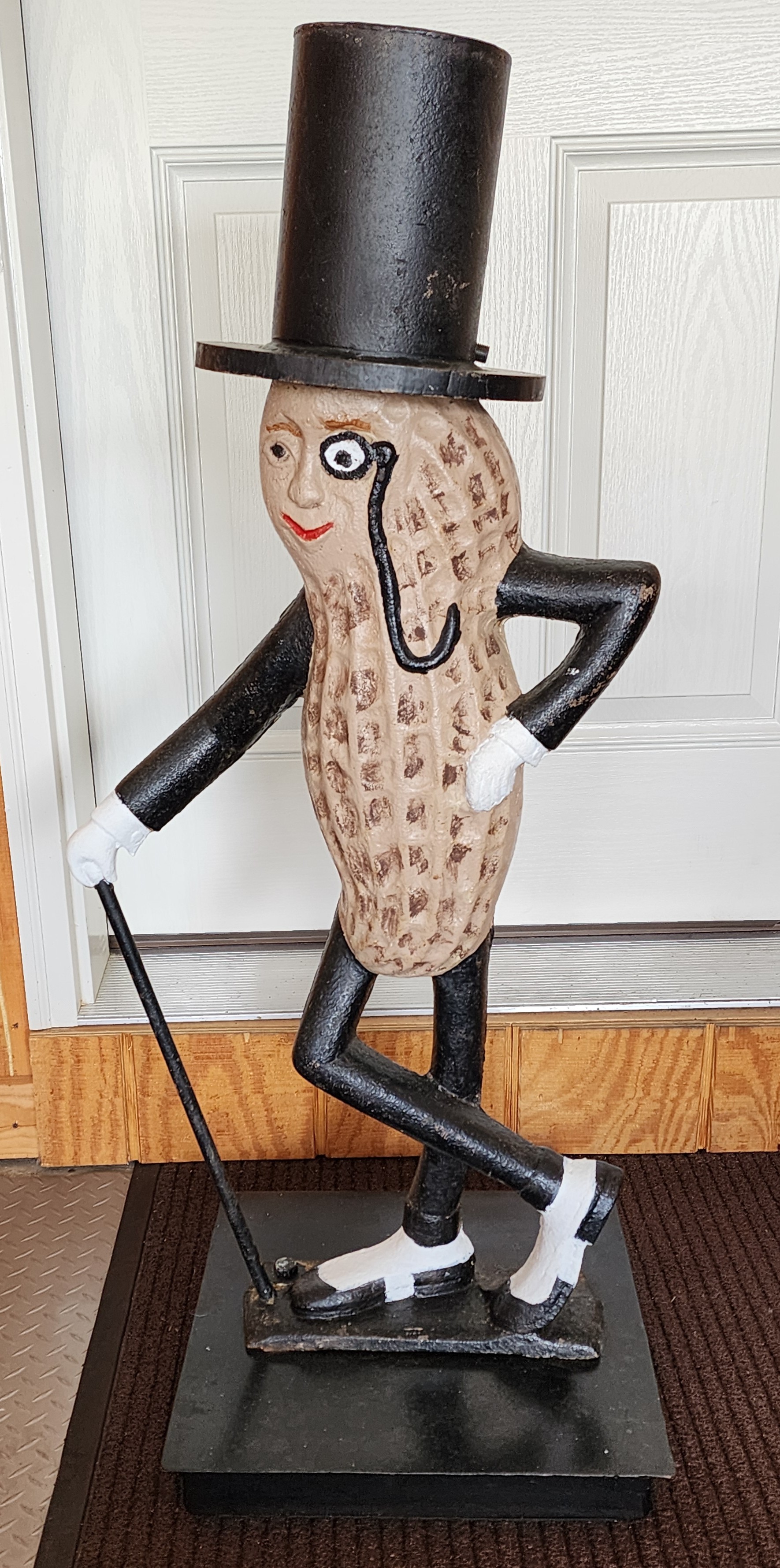 A CAST IRON MR. PEANUT STATUE